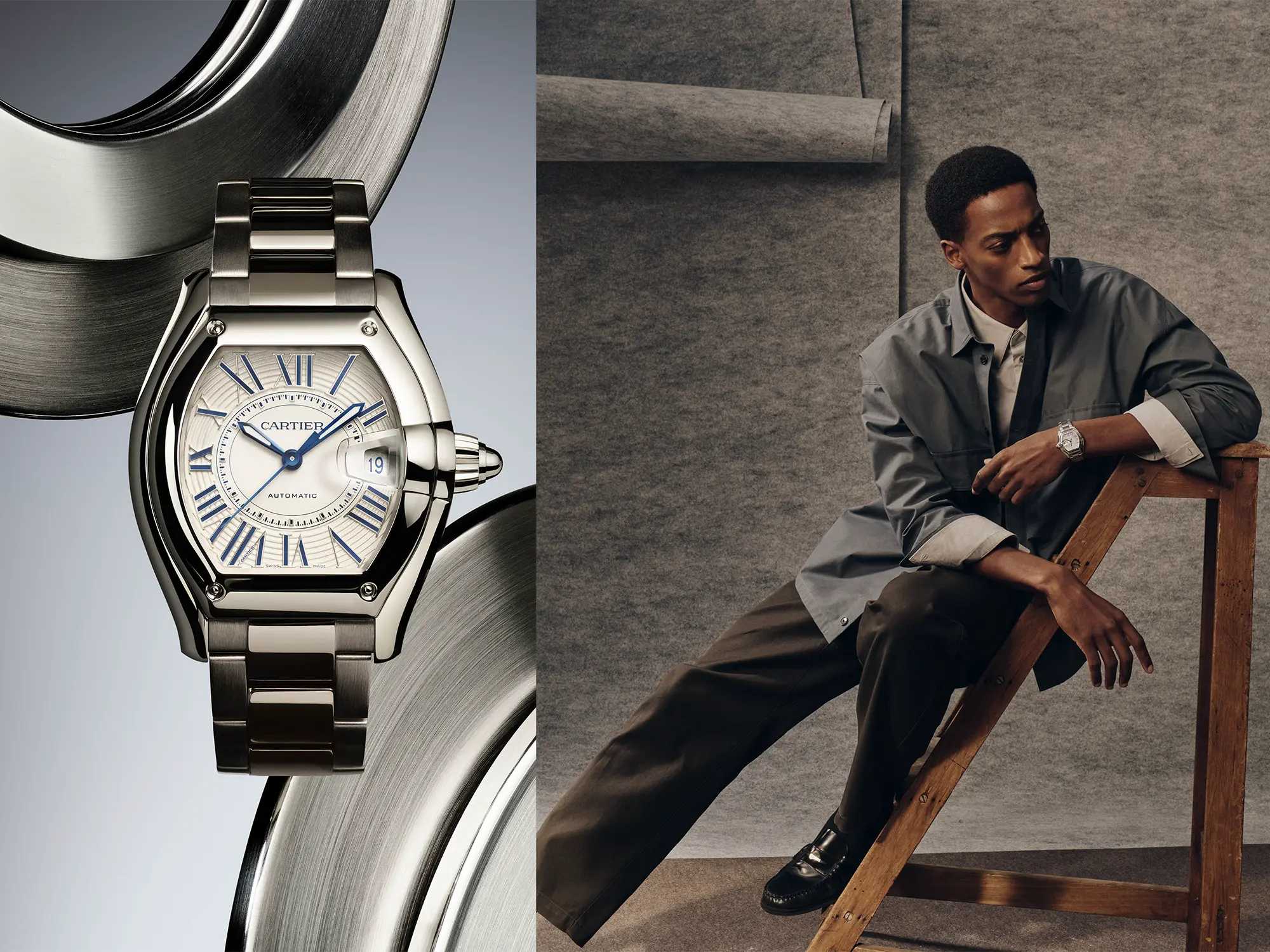 cartier-roadster-2026-ura Nova ura Cartier Roadster v jekleni izvedbi z značilno tonneau obliko in modrimi rimskimi številkami ob moškem editorial portretu.